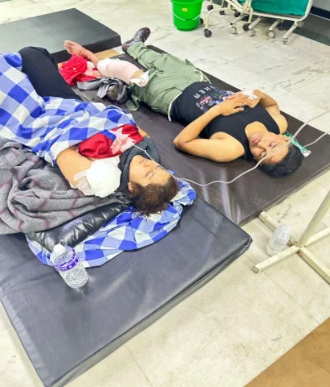 Liza Adhikari, taken on a stretcher to the National Trauma Center Hospital in Kathmandu—half an hour after she was shot.
